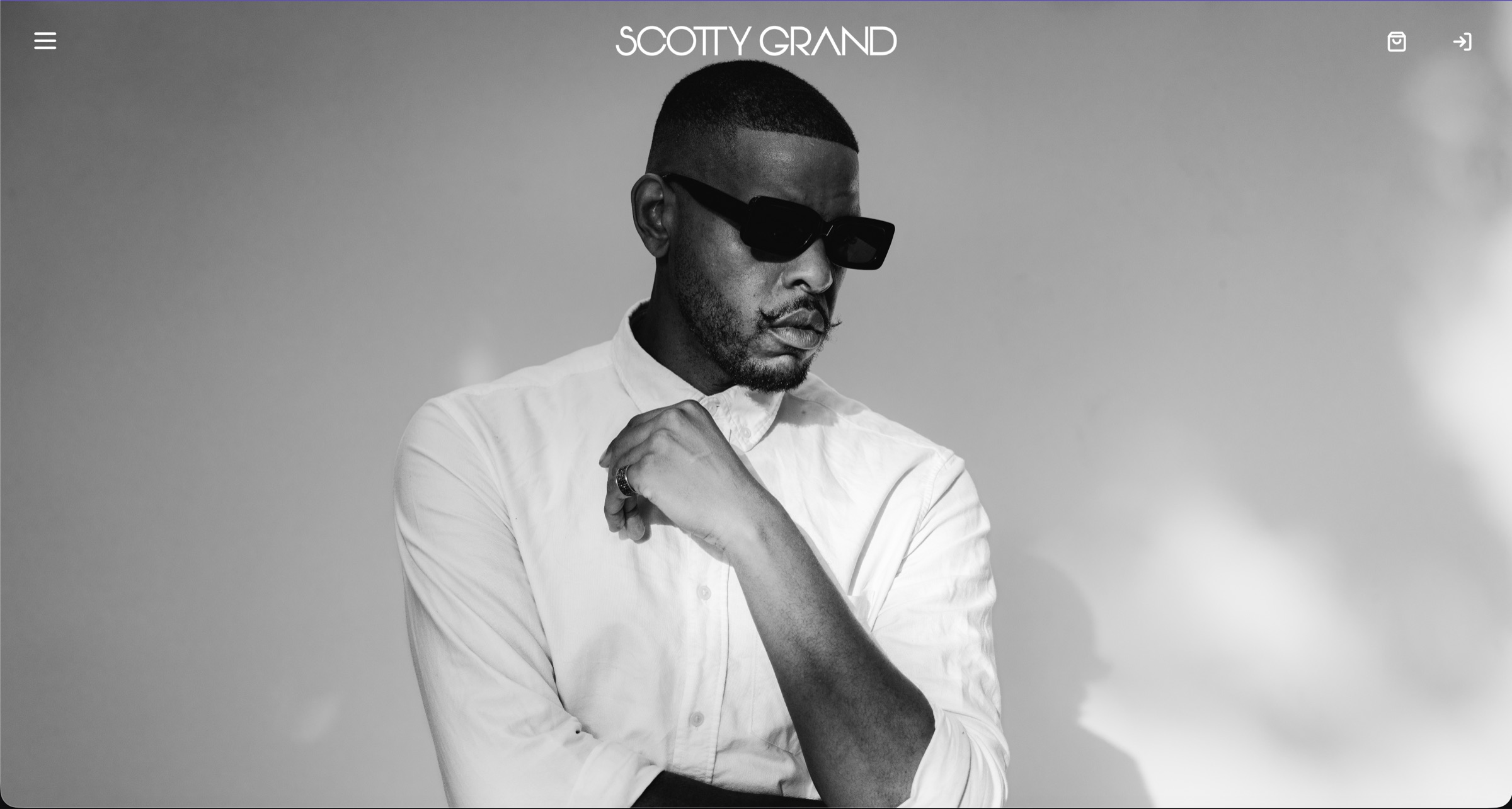 The Scotty Grand website opening on a full-screen black and white portrait beneath the wordmark